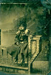 Tintype of Sad Young Black Girl Perched on Bench [n.d.]