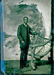 Tintype of African American Man Standing at Wooden Fence [n.d.]