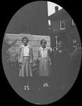Portrait of three young women in front of Colborne High School