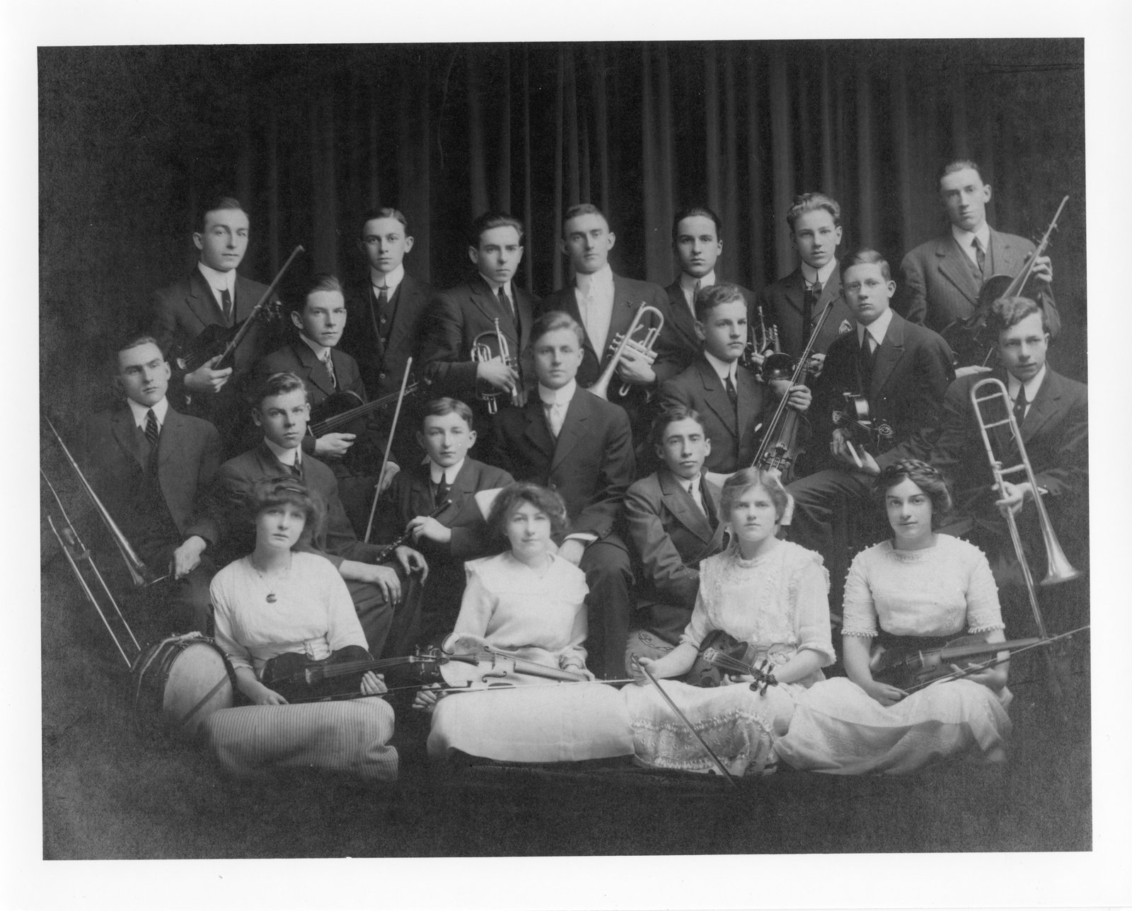 A co-ed group of musicians. The women in the front row play only stringed instruments. <br>Courtesy the London Public Library.