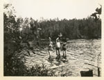 Three people swimming in Wilson Lake