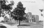 Public School, Burlington, Ont -- Exterior with large tree; psotmarked August 16, 1918