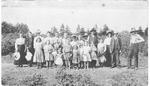 At farm of Wilson Henderson opposite site of Lions Park on Martha St. -- group of 22 people; dated 1900