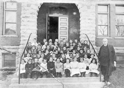 St. Bernard's Church Elementary School Students with Reverend Flannery