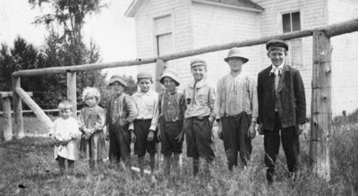 Children Standing In A Row Outside