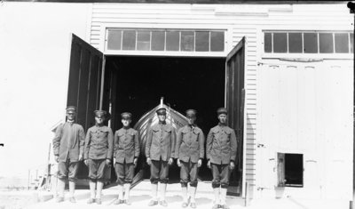 Middle Island:  Coast Guard Crewmen at Surfboat Building