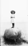Middle Island:  Esther Hartlep standing on big rock near shore of Lake Huron.