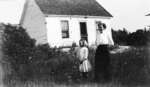 Middle Island:  Esther Hartlep and her mother, Lillian in front of dwelling.