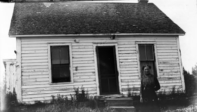 Middle Island:  Lillian Hartlep in front of dwelling.