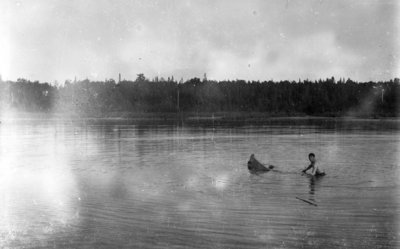 Middle Island:  Unidentified man with sinking canoe
