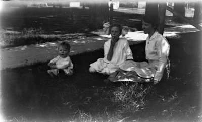 Hartlep Family Sitting in Grassy Shade in Summer