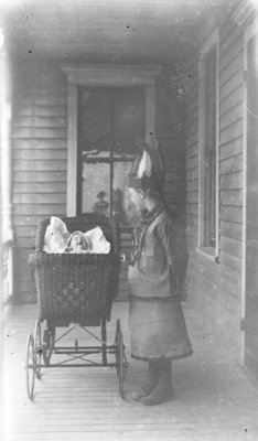 Donald and Esther Hartlep on the Porch of the Family Home at 616 Lockwood Street in Alpena, Michigan.