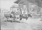 Men, Boys, and Carriage in Front of Store