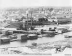 Lumber Mill on Thunder Bay River with Early Alpena County Courthouse in Background