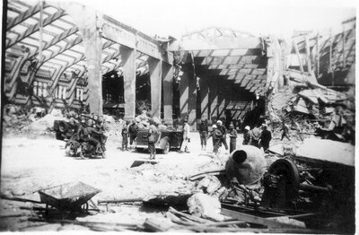 090 Army crew surveying damaged structure