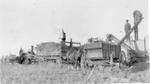 022 Farmers loading hay unto tractor wagons