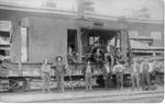 057 Crew of men posing around L.S. & M (Lake Superior & Mississippi) Railway car