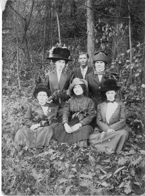 454 Unidentified group of five women and one man posing outside in the woods on an autumn day. c 1910s