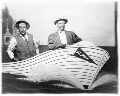 588 Two unidentified men posing in fake boat prop named “ALPENA”