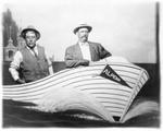 588 Two unidentified men posing in fake boat prop named “ALPENA”