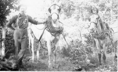 619 Unidentified man with two horses