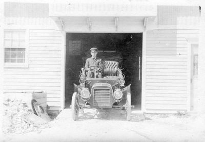 634 Driver in circa 1913 automobile