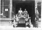 635 Two men driving a circa 1913 automobile