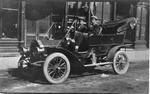 636 Two men sitting in circa 1913 automobile