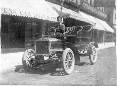 637 Driver sitting in circa 1913 automobile