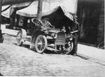 638 Mechanic standing by circa 1913 automobile