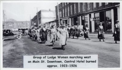 Brighton Lodge women marching west on Main Street approx 1923-1926.