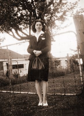 “Cottage Summer 1944, Aunt Laurine Cheer” standing by the gate.