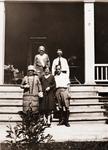 “Taken July 5th 1929 “The Grange” Brighton Ont. Canada (Prince Edward St). Photo of family on steps. Possibly includes Harry [Consintivean], husband of Cousin Maude bottom right and Maude in middle.