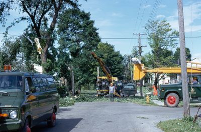 Bell Canada workers repairing damage after the tornado touch down in Brighton, Ontario, Canada in 1973.