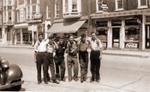 Six Guys on the street in front of the Hotel Clarendon in Brighton,Ontario.