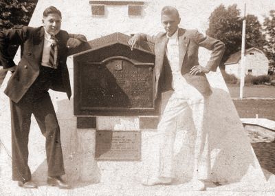 Two boys at the Cenotaph in Brighton, Ontario.  Carr, Harley; Kingsbury, George