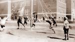 A group of boys test their agility and strength on the Giant Stride in the playground at Brighton Public School in 1933.