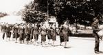 Uniformed Women Marching On Street