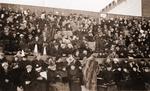 Bundled up crowd in a stadium.