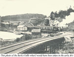 Train Leaving Burk's Falls with a Boat in Dock, circa 1930