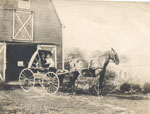 Two People Coming Out of a Barn in a Horse-Drawn Buggy, circa 1920
