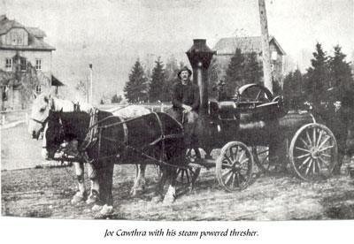 Joe Cawthra with his Steam Powered Threshing Machine, circa 1920