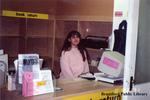 Employee at the Book Return Desk at the Brantford Public Library Carnegie Branch