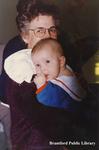 A Woman Holds an Infant at the Brantford Public Main Branch Opening Ceremonies