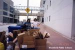 Staff Members with Recycling Behind the Brantford Public Library