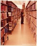 A Patron Browses the Shelves at the Brantford Public Library, Carnegie Branch