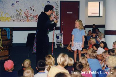 A Magician Performs for Children During Canada Book Day Celebrations