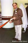 G.A. (Jerry) Porte Cuts the Ceremonial Ribbon at the Brantford Public Library Main Branch Grand Opening