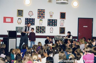 Magician Peter Mennie Performs for a Group of Children at the Brantford Public Library