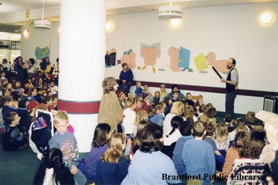 Magician Peter Mennie Performs for a Group of Children at the Brantford Public Library